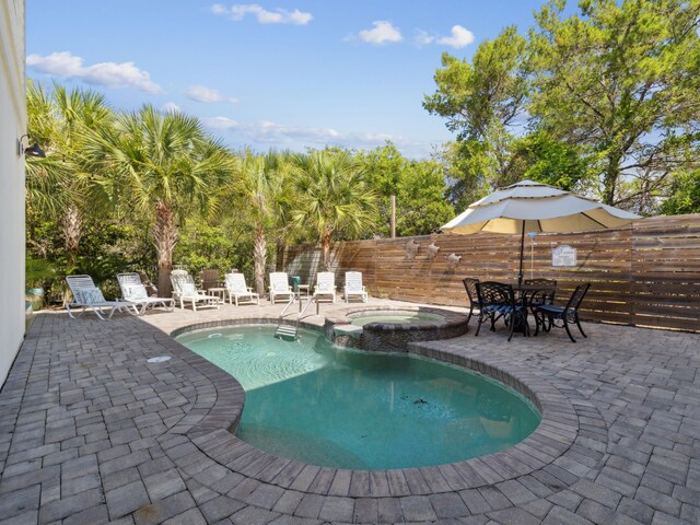 24 High Tide Way, Inlet Beach, FL 32461 - view of pool featuring a patio area and a pool with connected hot tub
