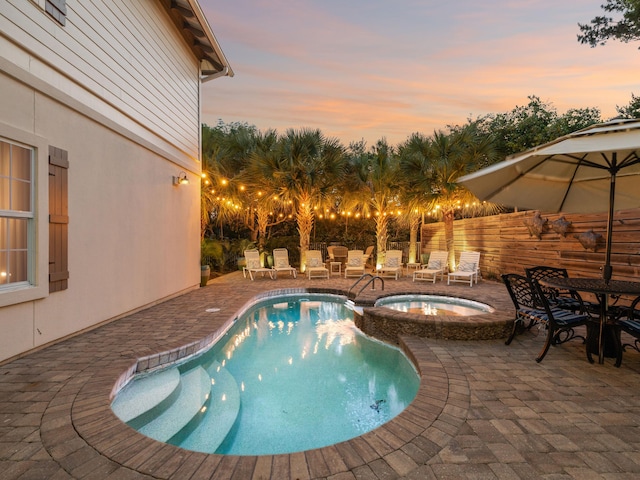 24 High Tide Way, Inlet Beach, FL 32461 - pool at dusk featuring a patio area and a pool with connected hot tub