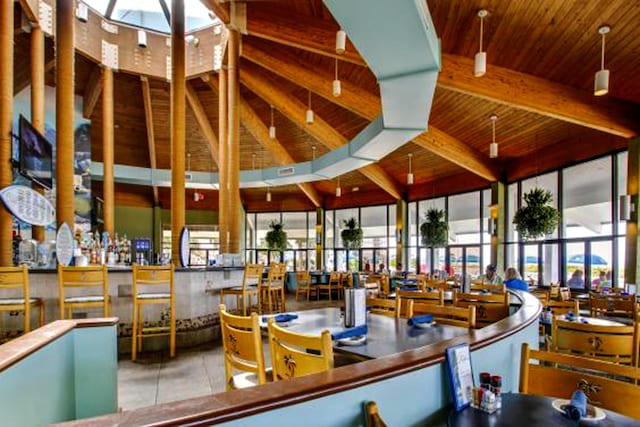 11757 Front Beach Rd Unit W106, Panama City Beach, FL 32407 - lobby featuring wood ceiling with exposed beams and a high ceiling