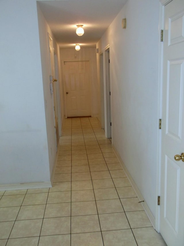 hallway featuring light tile patterned floors