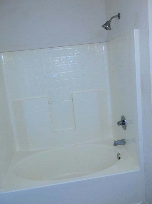 bathroom with shower / washtub combination