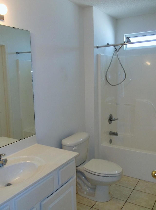 full bathroom featuring vanity, a textured ceiling, tile patterned flooring, toilet, and  shower combination