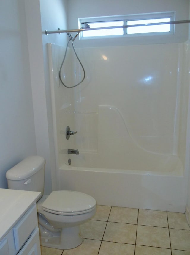 full bathroom featuring shower / tub combination, vanity, toilet, and tile patterned floors