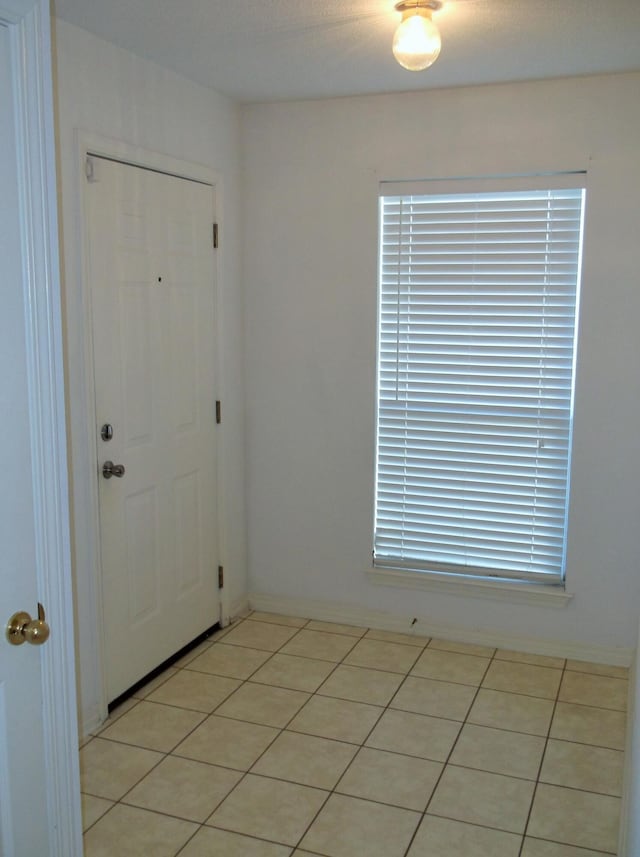 entrance foyer featuring light tile patterned floors