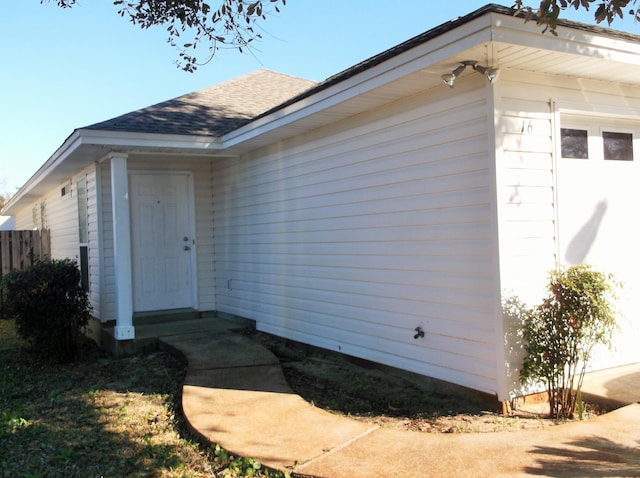 entrance to property featuring a garage