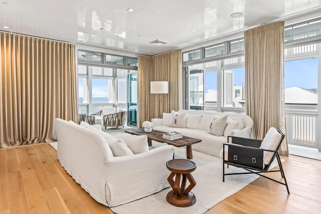 290 Sea Garden St Unit 402, Alys Beach, FL 32461 - living room featuring light hardwood / wood-style floors and expansive windows