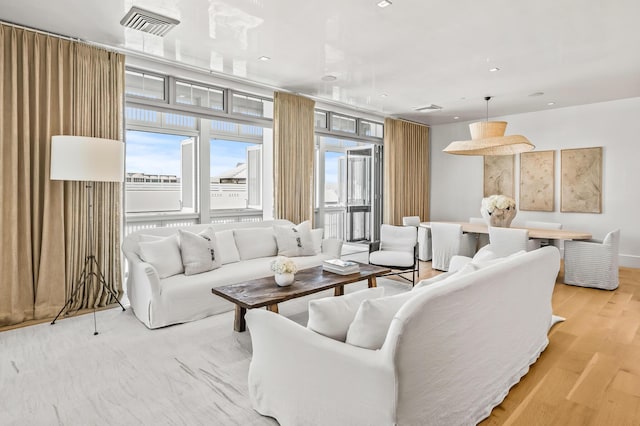 290 Sea Garden St Unit 402, Alys Beach, FL 32461 - living room with light wood-type flooring