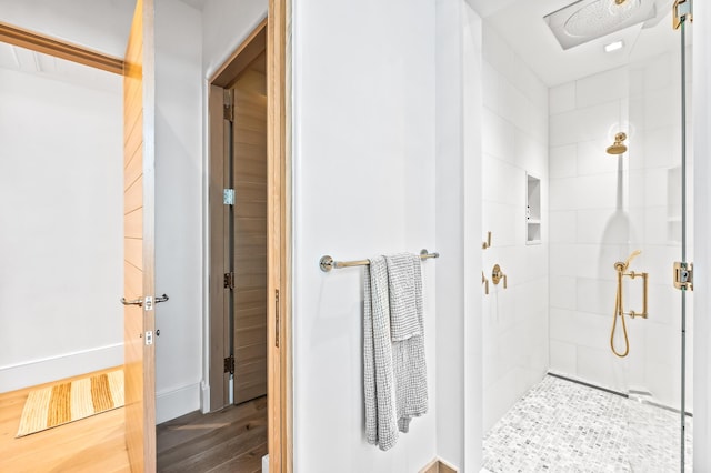 290 Sea Garden St Unit 402, Alys Beach, FL 32461 - bathroom with hardwood / wood-style flooring and tiled shower