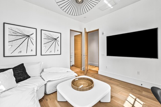 290 Sea Garden St Unit 402, Alys Beach, FL 32461 - living room featuring light hardwood / wood-style floors