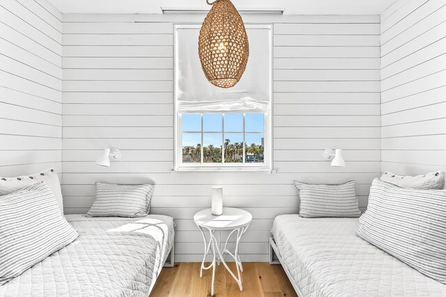 290 Sea Garden St Unit 402, Alys Beach, FL 32461 - bedroom with wooden walls and wood-type flooring