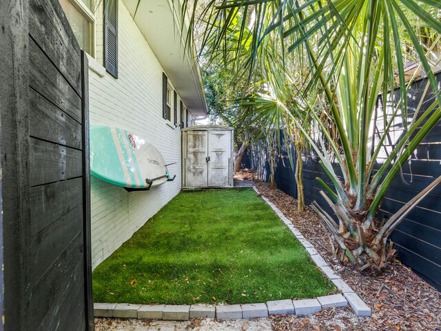 38 Barracuda St, Santa Rosa Beach, FL 32459 - view of yard featuring an outdoor structure and a shed
