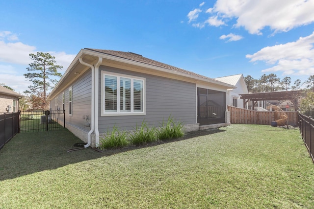 105 Oyster Blvd, Freeport, FL 32439 - rear view of property featuring a sunroom, a fenced backyard, a yard, and a pergola