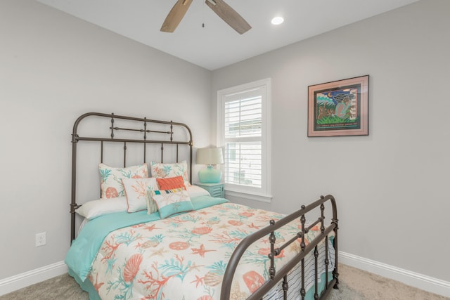 105 Oyster Blvd, Freeport, FL 32439 - bedroom with light carpet, ceiling fan, and baseboards