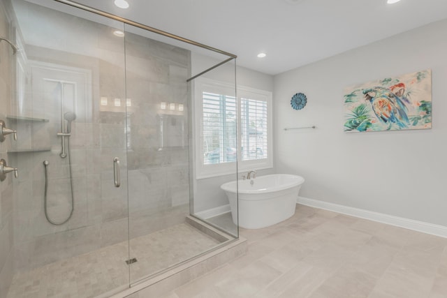 105 Oyster Blvd, Freeport, FL 32439 - full bath with a freestanding bath, recessed lighting, a shower stall, and baseboards
