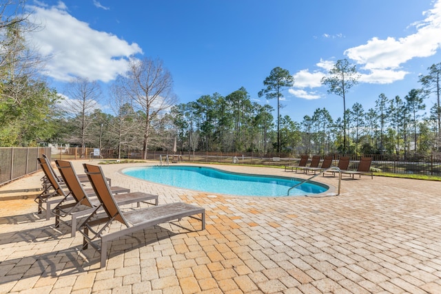 105 Oyster Blvd, Freeport, FL 32439 - pool with a patio area and fence