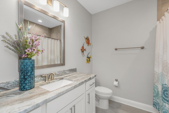 105 Oyster Blvd, Freeport, FL 32439 - full bathroom with tile patterned flooring, toilet, vanity, and baseboards