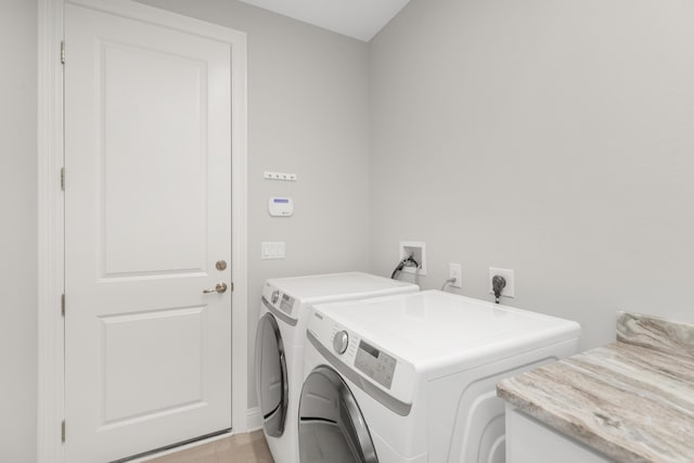 105 Oyster Blvd, Freeport, FL 32439 - clothes washing area featuring laundry area and washer and dryer