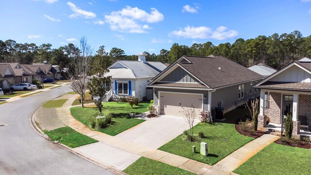 105 Oyster Blvd, Freeport, FL 32439 - ranch-style home featuring driveway, a front lawn, board and batten siding, and a residential view