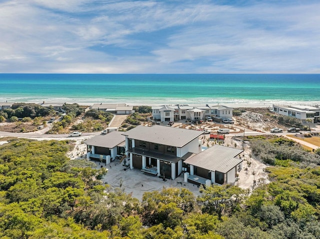 bird's eye view with a water view and a view of the beach