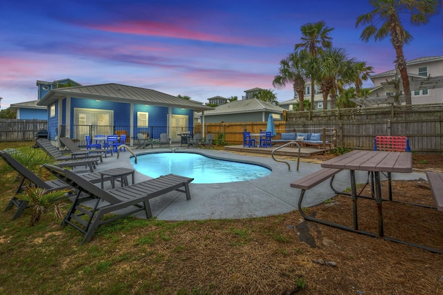 view of pool with a patio, a fenced backyard, and a fenced in pool