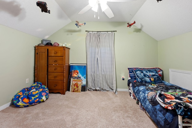 bedroom with lofted ceiling, ceiling fan, baseboards, and light colored carpet