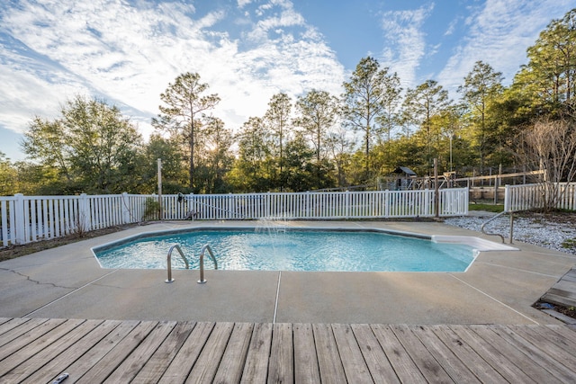 view of swimming pool with a patio, fence, and a fenced in pool