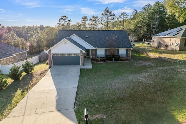 single story home with fence, a front lawn, concrete driveway, and brick siding