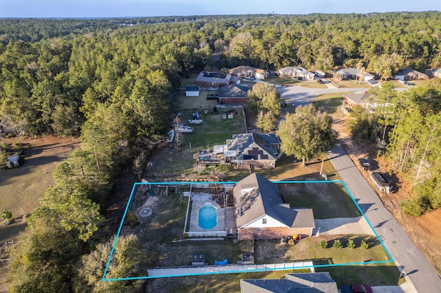 drone / aerial view with a view of trees