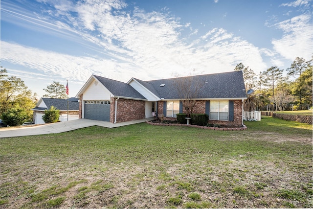 ranch-style home with brick siding, concrete driveway, fence, a garage, and a front lawn