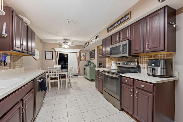 kitchen featuring ceiling fan, visible vents, appliances with stainless steel finishes, and light countertops