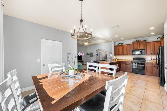 dining space featuring arched walkways, recessed lighting, light tile patterned flooring, baseboards, and ceiling fan with notable chandelier