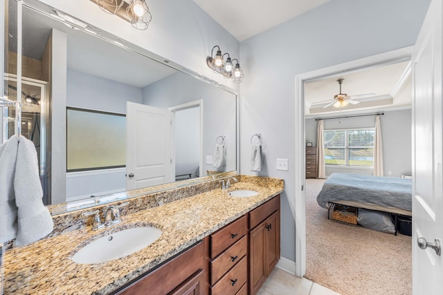 full bath featuring connected bathroom, a shower with shower door, a sink, and double vanity