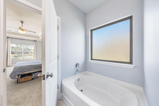 ensuite bathroom with a garden tub, a ceiling fan, and ensuite bathroom