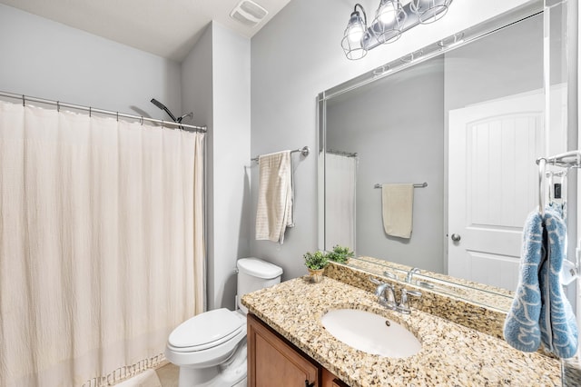 full bath featuring visible vents, vanity, and toilet