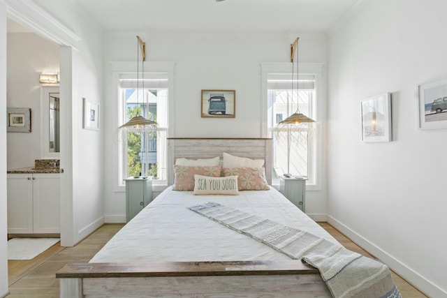 125 Gulfview Cir, Santa Rosa Beach, FL 32459 - bedroom with light wood-type flooring and connected bathroom