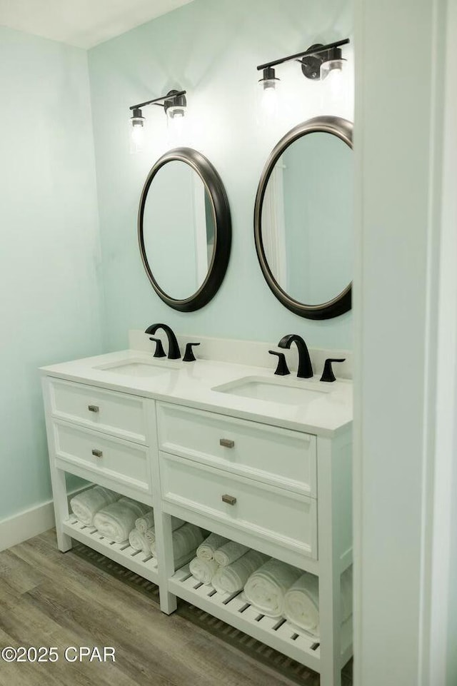 bathroom featuring vanity and wood-type flooring