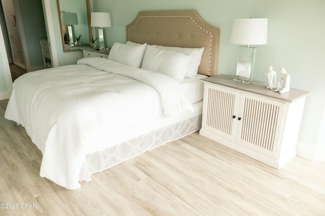 bedroom featuring light wood-type flooring