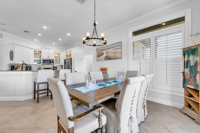 dining space featuring a notable chandelier, light tile patterned floors, recessed lighting, ornamental molding, and a textured ceiling