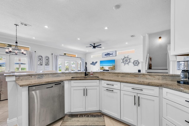 kitchen featuring a sink, visible vents, white cabinetry, light stone countertops, and dishwasher