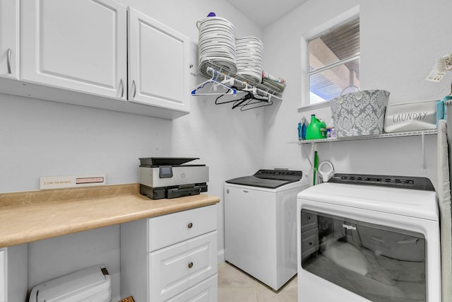 washroom with light tile patterned flooring, cabinet space, and separate washer and dryer