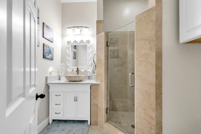 bathroom with a stall shower and vanity