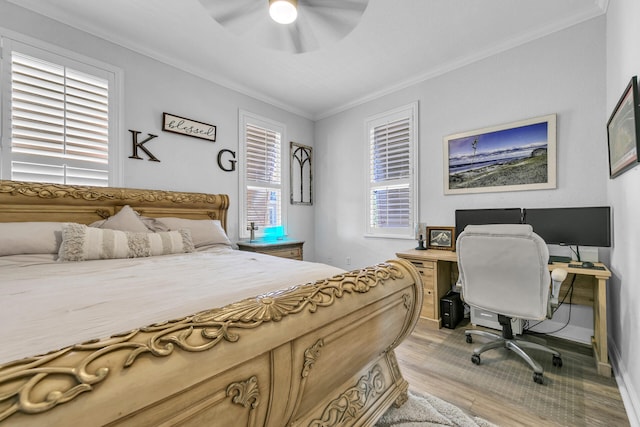 bedroom with light wood finished floors, baseboards, a ceiling fan, and crown molding