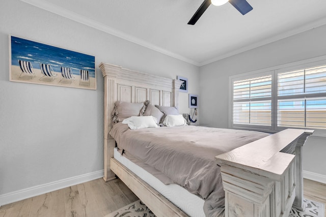 bedroom featuring baseboards, crown molding, a ceiling fan, and light wood-style floors