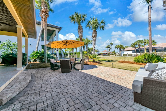 view of patio / terrace featuring outdoor dining space and a grill