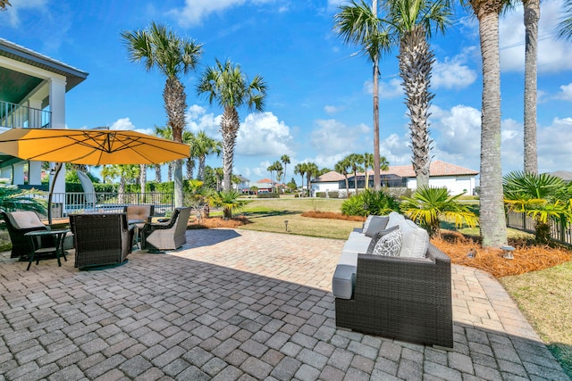 view of patio with outdoor lounge area, fence, and outdoor dining area