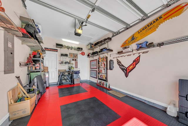 garage with a garage door opener and baseboards