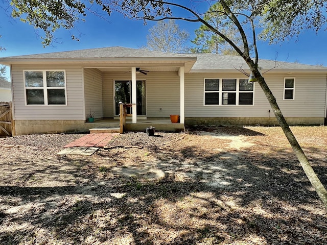 back of house with ceiling fan and a patio