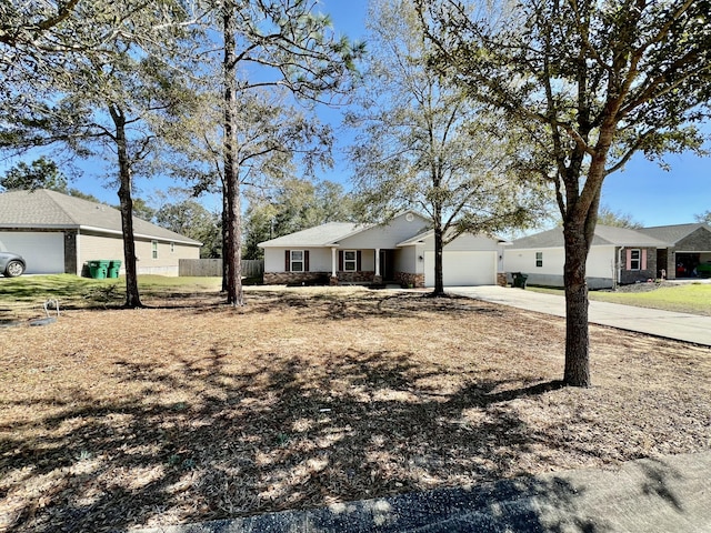 ranch-style house featuring a residential view, driveway, an attached garage, and fence