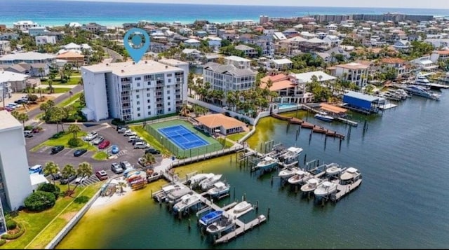 birds eye view of property with a water view