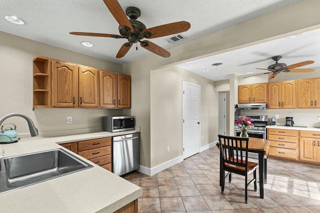 kitchen with light countertops, open shelves, a sink, and stainless steel appliances